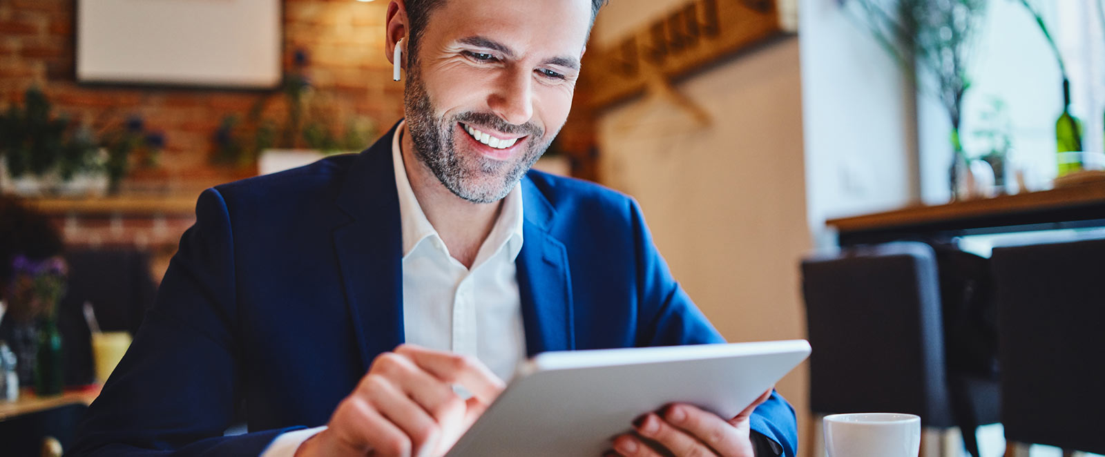 Businessman using tablet in lobby