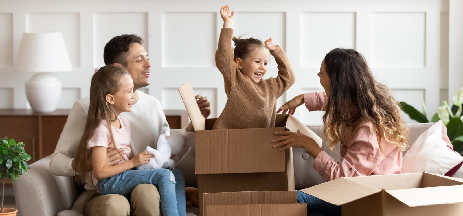Young family unpacking in new house
