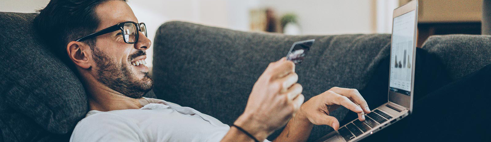 Man shopping from home on laptop